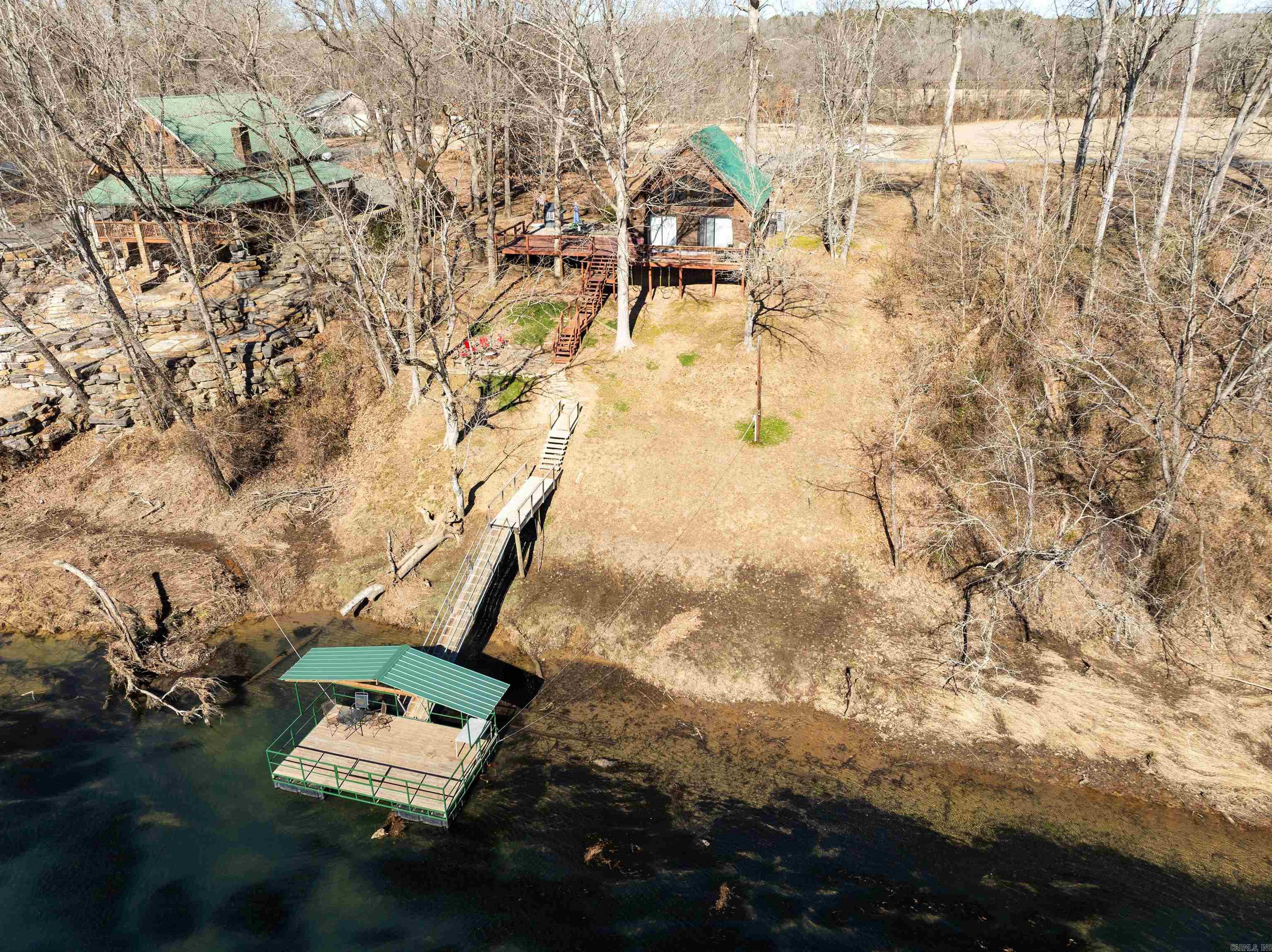Great River Front home that's ready to welcome you and your guests! This home comes mostly furnished and has a great short term rental history! Quiet neighborhood with very little traffic... New dock (2023) that sits just up river from a coveted trout hole! Must see this one to appreciate it... It won't last long at this price!