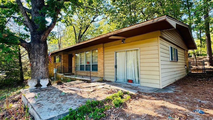 Ranch house that needs total renovation. It is directly across from platted and dedicated lake access lot and has nice view of the lake. This property also has a permitted floating swim dock that can be transferred to a new owner with Entergy approval. Seller inherited the property and there is no Seller Property Disclosure and intends to sell "AS IS". All items in the house and on the grounds the Seller intends to leave with the property. Utilities are not connected at this time.