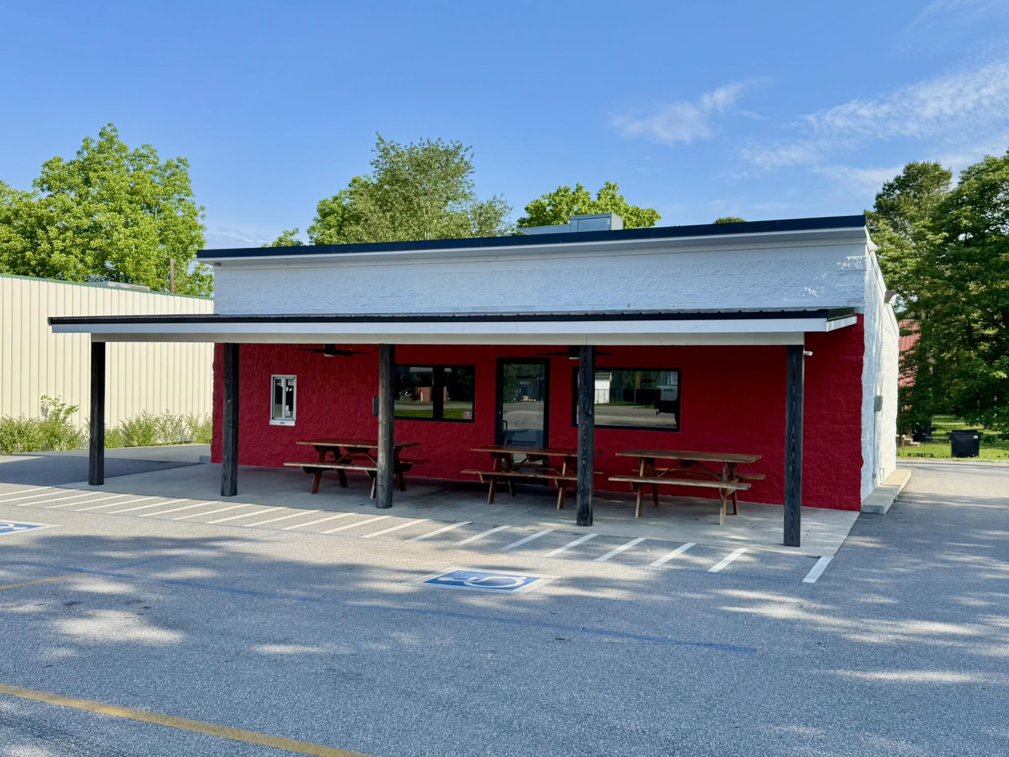Prime opportunity on Main Street in Melbourne! This commercial building, formerly a drive-thru restaurant, is perfectly positioned for high visibility and easy access with paved parking directly off the main road. The property features a kitchen fully equipped with all appliances and fixtures, a food prep area, two convenient storage rooms, one bathroom, and a welcoming front porch ideal for customer seating. Whether you're continuing in the food industry or reimagining the space for a new venture, this site offers excellent potential. Owner financing is available, making it easier than ever to bring your business vision to life.