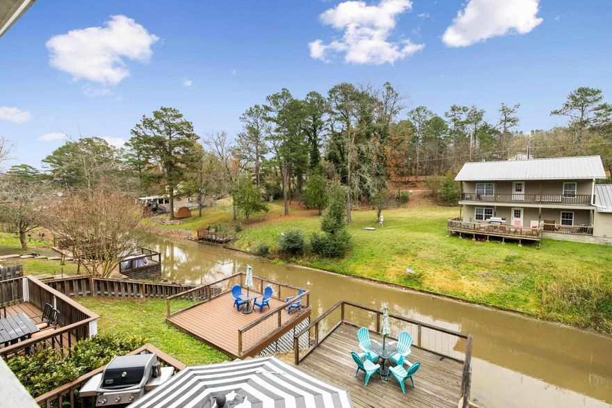 Welcome to a rare lakeside retreat on Majestic Lodge Road where Units A and B blend comfort, character, and an atmosphere that feels like a private escape. Both units are fully furnished and beautifully updated with modern finishes and tiled walk in showers. Large windows invite in natural light while the lodge inspired design creates a warm relaxing setting that fits perfectly with the surrounding trees and peaceful lake views. Step outside and enjoy direct access to the water with tie ups ready for your boat or guests arriving by lake. Whether you are searching for a personal getaway or a flexible property with standout appeal, this unique pair of units offers a calm inviting setting that feels like vacation living every day.  TWO 3BR 3BA Units with Lake Hamilton Frontage and IDEAL for investment! These two units have no POA fees and are inclusive of the property they are on. Lake frontage is on the back side; no boat dock, but tie-ups are allowed. One of the units has had many upgrades; the other unit has not had upgrades, but is nice also! These would be available for VRBO or long term tenants.