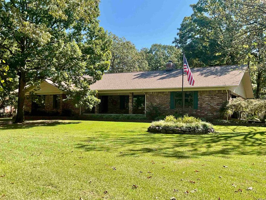 EAGLE MOUNTAIN, Beautiful and elegant Brick home tucked under the big shade trees on .88 acre lot. You will see attention to detail from the time you arrive with a clean yard and flower beds and a sprinkler system to keep it watered. An attached over-sized 2 car garage has a pull-down to access the floored attic.Total of 4 cars  including the detached garage/shop  The home is a total of 4100 square feet on one level but could be used as the main home of 2,600 sq ft and a guest house, or mother-in-law quarters or a rental Etc.. It has a full kitchen, living-room, two bedrooms, 2 baths and laundry room, 1500 sq ft.  The main home has vaulted living room with wood burning fireplace and built in bookcases on each side. Beautiful hardwood and tile floors throughout. You will love the kitchen with all the beautiful oak cabinets and Quartz counter tops, large pantry, gas cook stove, with down draft.  Spacious Main bedroom with main bath and jetted tub,  double sinks, and walk-in closet. Two bedrooms with a Jack and Jill bath. Crown molding throughout the home, extra insulation, Anderson windows and doors, very energy efficient. Large work shop heated and cooled. Extra storage Bldg.