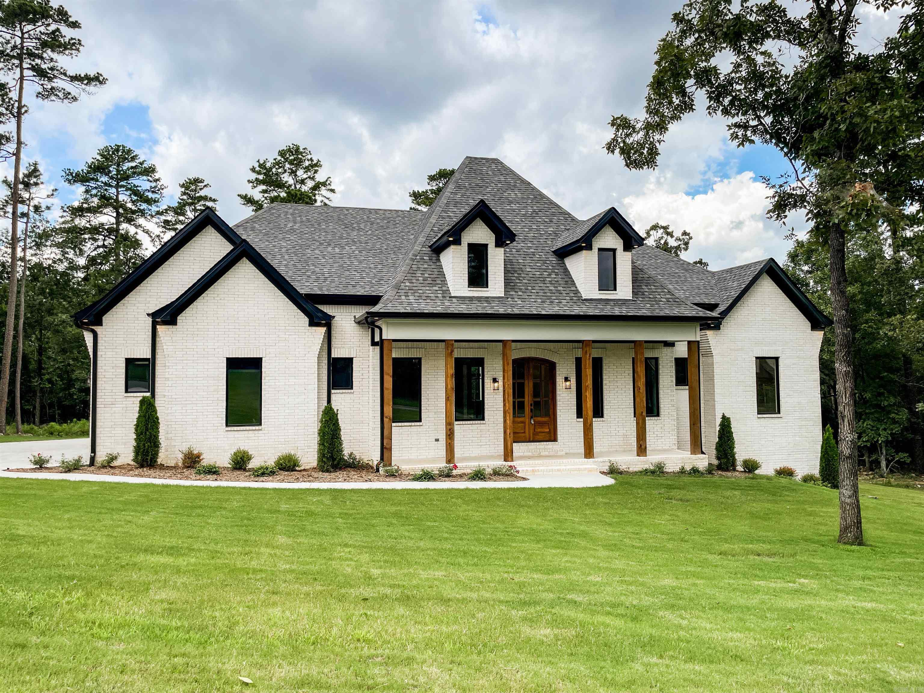 Once you pull through the incredible arched gatehouse of Waterview Estates you will find soon after all the neighborhood amenities such as the pickle ball courts, tennis court, two basketball courts, soccer/football area, community bonfire area, and miles of hand carved nature walking trials! The home backs up to a large green space area that offers a unique sense of privacy blocking any neighbors behind you. The lots also offers a sense of ample space with its 150' of road frontage. The home itself boast natural light with the tall ceilings and large windows. Every room designed to feel spacious, every bedroom to have its own walk in closet and private bathroom as well! All finishes that have not already been installed can be customized by the buyer unless already ordered! Large amount of unfinished space that can be finished out as well adding additional rooms to the home!