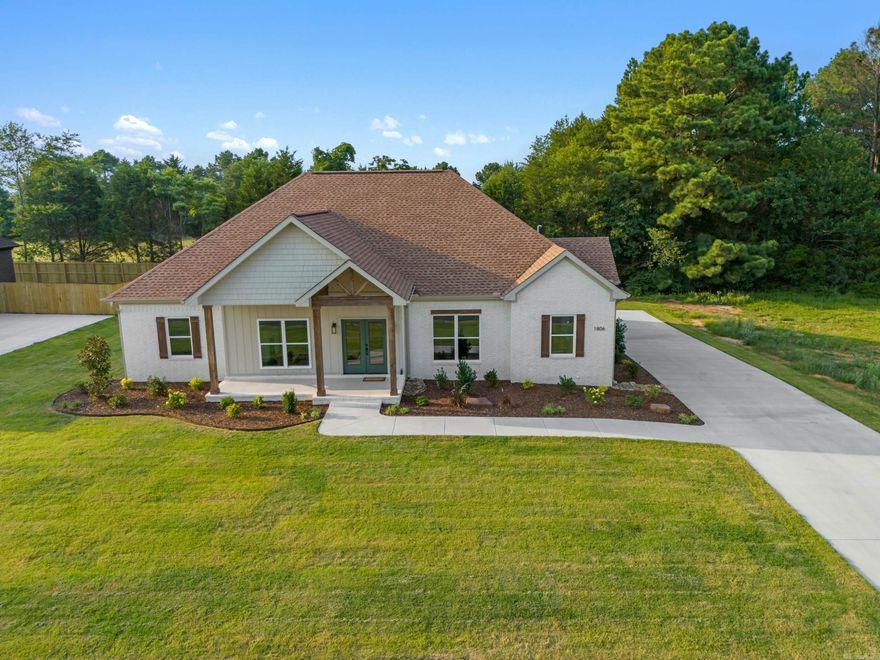 Very nice new construction 4 bedroom, 2.5 bath brick house in Searcy's newest neighborhood "Belmont Estates" located just down from Searcy Country Club. This newly developed subdivision has protective covenants which includes 2,000 sq. ft. minimum build homes. This split but open floorplan house has granite countertops including a light green tile backsplash & matching island in the kitchen, custom shaker farmhouse cabinets, 9-foot ceilings, gas fireplace, gas tankless water heater, water resistant wood laminate flooring with luxury waterproof squares in baths. The main bedroom has a bath with 2 sinks, linen, custom shower & soaker tub. large walk-in closet & large separate laundry also has lots of storage. Sodded yard & nice professional landscaping. It is almost finished & should be completely finished in August 2024.