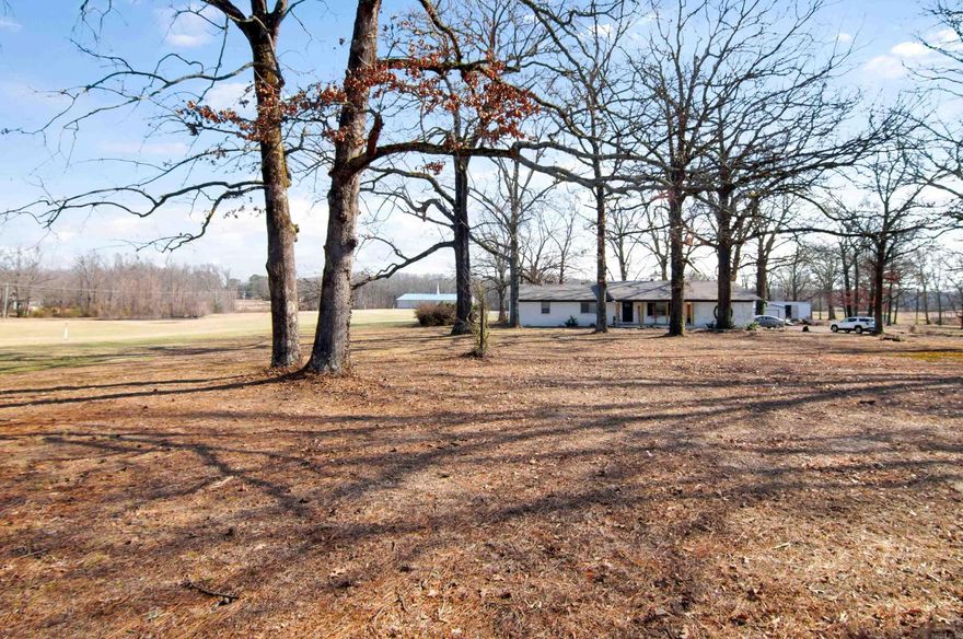 A rare opportunity to have a 2nd tiny home on property.  This 2nd home is complete with a living area, bedroom, kitchen/dining area.  It could be used for in-law quarters, a college student, or home office.  The main home has been updated with new electrical wiring, new intake pex plumbing, and freshly painted.  The septic system has also been updated with new field lines.  One bathroom has been updated a U by Moen shower system.  Original hardwood flooring adds a touch of warmth to the home.  There is no better way to spend those long winter nights than cozying up in front of the wood burning fireplace.  Summer heat calls for pool parties!  Entertain family and friends all summer.  There is plenty of space in the screened back porch also.  This one has it all.  *Agents see remarks*