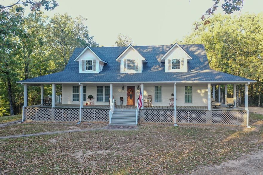 Perfect home on acreage for the owner looking to enjoy life both indoors and out.  This home feels larger than its footprint.  The main bedroom features an en-suite bathroom with heated flooring, and a large, functional closet. The second bedroom also features ample storage and has a welcoming feel.  The living areas are open, light, and airy, providing a sense of warmth. The living room and kitchen are combined into one unit, allowing for easy fellowship.  Large, energy efficient triple paned windows enhance the feel of the home.  Hallways and entrance ways have extra width for easy movement. A gated entrance and fencing provide privacy and safety.  A garage offers excellent storage or workspace-its semi-finished upstairs is an opportunity for expansion.  The grounds feature hardwoods, evergreens, trails, a pond, and pasture.  Seller will sell with most furnishings or unfurnished.