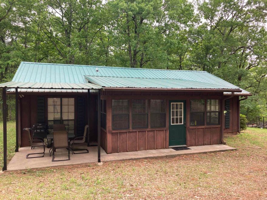 TURN KEY Vacation home, rental or perfect place for a simpler life! Offered fully furnished with lots of privacy on 16.52 acres that borders NATIONAL FOREST on three sides! It offers trails throughout to ride all over the 16+ acres, or you can meander off the property and ride the national forest. This home has a open concept living, kitchen and dining space with vaulted ceilings that make the space feel much larger. Two separate bedrooms on opposite sides of the living room with their own full bathrooms. It also has a glassed in back patio and additional covered outside patio. Shop and 220V power available, and new central heat and air. Close to all of Mena's amenities with the country feel. Centrally located minutes from hiking trails and the NEW BIKE TRAIL SYSTEM.