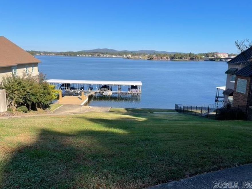 Unbelievable lake view with year around deep water! This lot has the seawall in place, a covered boat slip and a personal watercraft dock! Wonderful location and Lakeside School District. Ready to build your dream home!