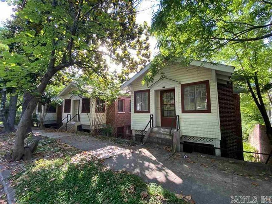 Vacant and ready for new owner to do renovations to this cool vintage motor court. Concrete pour construction with large garage bays beneath and plenty of parking in the back. Cottage in the back in included and 2 bed 1 bath, low ceilings. Located behind the Garland County Historical Society with no other addresses on Bolton to share with. Faces Prospect Ave. having huge potential. In the Prospect Quapaw Historic district but not designated as an address for renovations, no restrictions.