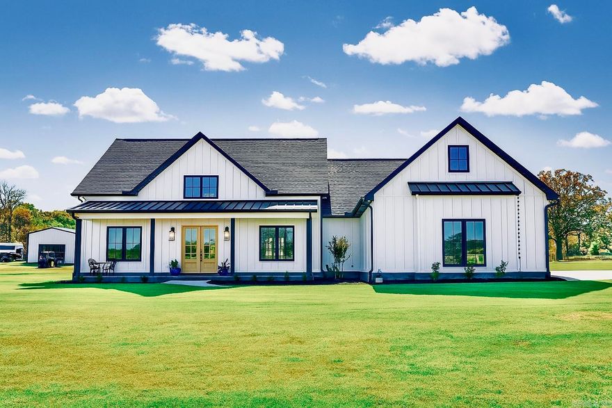 If there were ever a perfect home, this might be it!   From the safe room in the primary closet to the electrical outlets in the eaves for your Christmas lights, not even the smallest detail was overlooked when designing this beautiful, newly constructed modern farmhouse! Stepping in the front door, you immediately feel a sense of grandeur as you take in the stunning chandelier overhead, 20-foot ceilings, floor-to-ceiling fireplace surround, gorgeous built-ins, huge kitchen island, and top-of-the-line GE Cafe appliances. The open living area is flooded with natural light from two sets of 8-ft Windsor patio doors on either side of the electric fireplace and Windsor windows. A second electric fireplace adds warmth to the primary bedroom while a wood-burning fireplace completes the 1000 sq ft covered back patio.   The 30x40 detached shop is complete with an apartment-including a full kitchen, bath & laundry, and upstairs storage space.   The almost 10-acre tract is cross-fenced with an insulated 24x24 show barn finished with cedar walls, power & water, and a 16x16 3-sided cedar barn, another enclosed barn with 16x16 attached pen, and a 1/2 acre stocked pond!