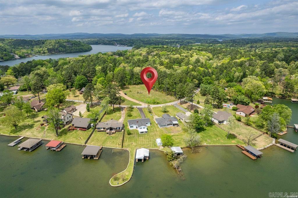 Beautiful level lot located across the street from the lake with view of Lake Hamilton. Perfect place to build your dream home. Lot has been cleared, surveyed and had a perk test performed. Utilities at the street. Bring your house plans and get started on building your dream home. Note: Pictures show both lots and notate the divided lots. See also CARMLS #25016093