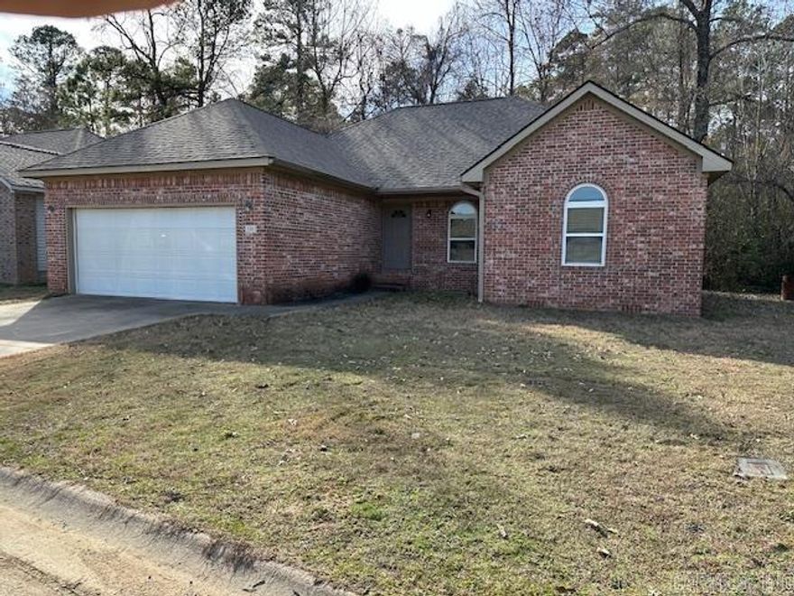 Wow, Like NEW! Fresh Paint throughout! NEW LVP Hardwood Floors throughout except bathrooms which are tile! NEW Deck! Almost New Roof!  Small back yard back up to woods and is private, but has adjoining large level vacant lot that could double as play area if needed. Great neighborhood is very safe and close to Bauxite Schools and just a few minutes to Bryant or Benton and I-30. NEW Dishwasher and Microwave too! Open Concept floor plan has split Bedrooms and large primary bath has separate tub and separate shower and large walk in closet! Very Nice and clean and ready to move into! Double garage has auto opener and separate laundry room. Large Family room and Big Breakfast Bar and spacious kitchen! AVAILABLE NOW! Sorry, No Section 8 or Housing.  Will consider small dog - No dangerous breeds. Small yard is not fenced. $1495/mo Rent and Deposit is $1495.  All Electric