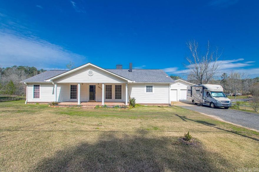 NEED A HOME IN THE COUNTRY WITH ACREAGE!    2,036 sq ft with 2BR 2.5BA on 1.15 acres! EXTRA ROOMS - office, sunroom, dining, laundry & game room. Gas log fireplace, gas range stove, cedar closets, and 4 French drains. Only 1/2 mile to fire dept. This property qualifies for RD (Rural Development) financing, offering potential zero down payment options for eligible buyers!