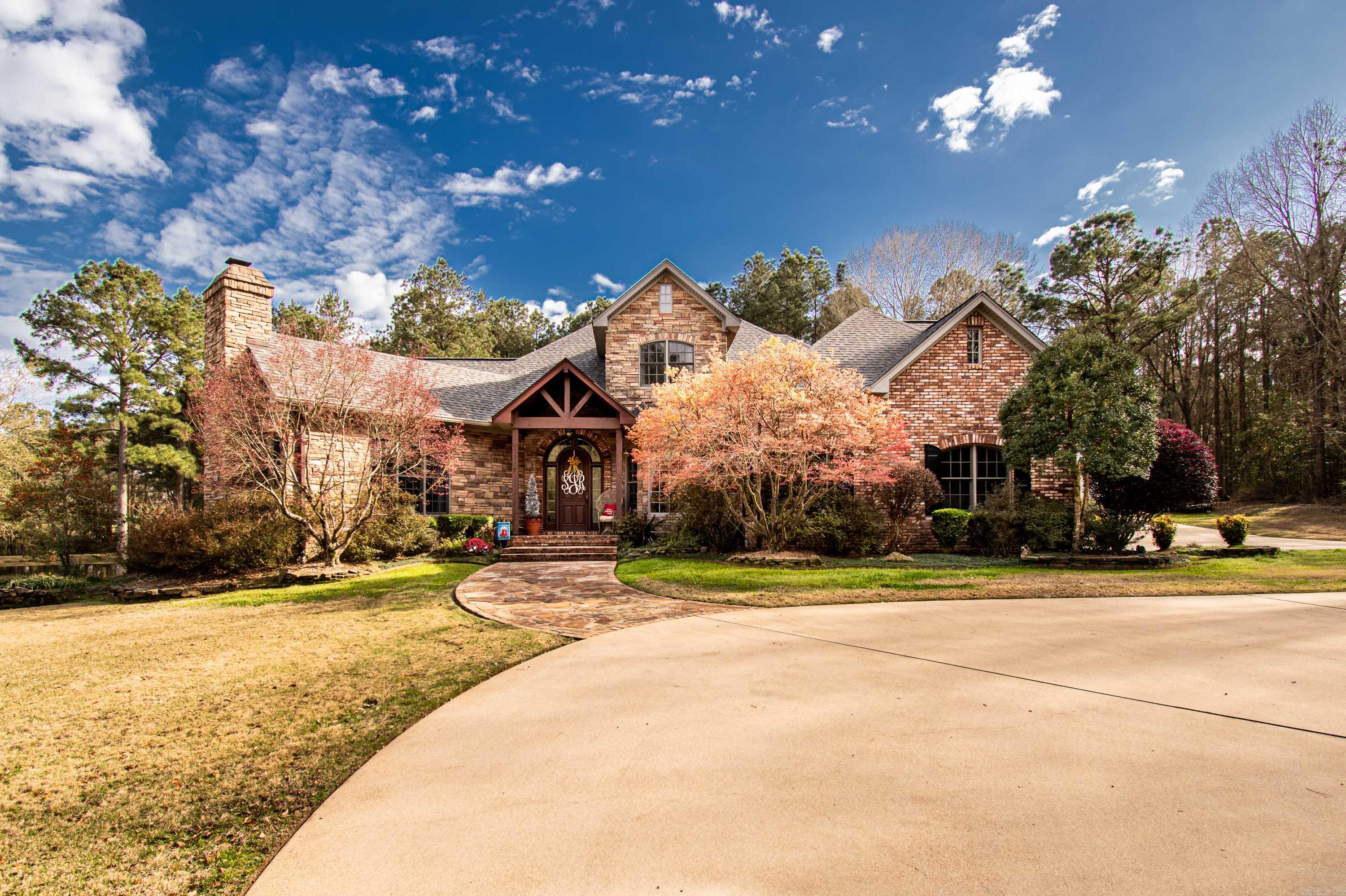 Nestled on a sprawling 8.23-acre estate with its own picturesque pond and a detached 2-car garage, this magnificent 4 bedroom, 4.5 bathroom home offers an unparalleled blend of privacy, elegance, and modern amenities. Whether you are seeking a peaceful sanctuary or an entertainer’s paradise, this property promises to exceed every expectation. Master Suite Haven: Dive into comfort in the expansive master suite, complete with a cozy fireplace for chilly evenings. The suite boasts a massive en suite bathroom featuring a large Jacuzzi tub, an oversized walk-in shower, and a vast walk-in closet tailor-made for the wardrobe enthusiast. Private Bathrooms: Each bedroom is accompanied by its own full bathroom, ensuring privacy and convenience for family members and guests alike. Elegant Living Spaces: Host memorable dinners in the formal dining room or enjoy casual family moments in the spacious family room with another beautifully crafted fireplace as the centerpiece. Specialty Rooms for Lifestyle: A dedicated study provides a serene environment for work or reading, while the game room is ready for entertainment and fun, making it perfect for game nights.*DRAPES IN MASTER DON'T CONVEY