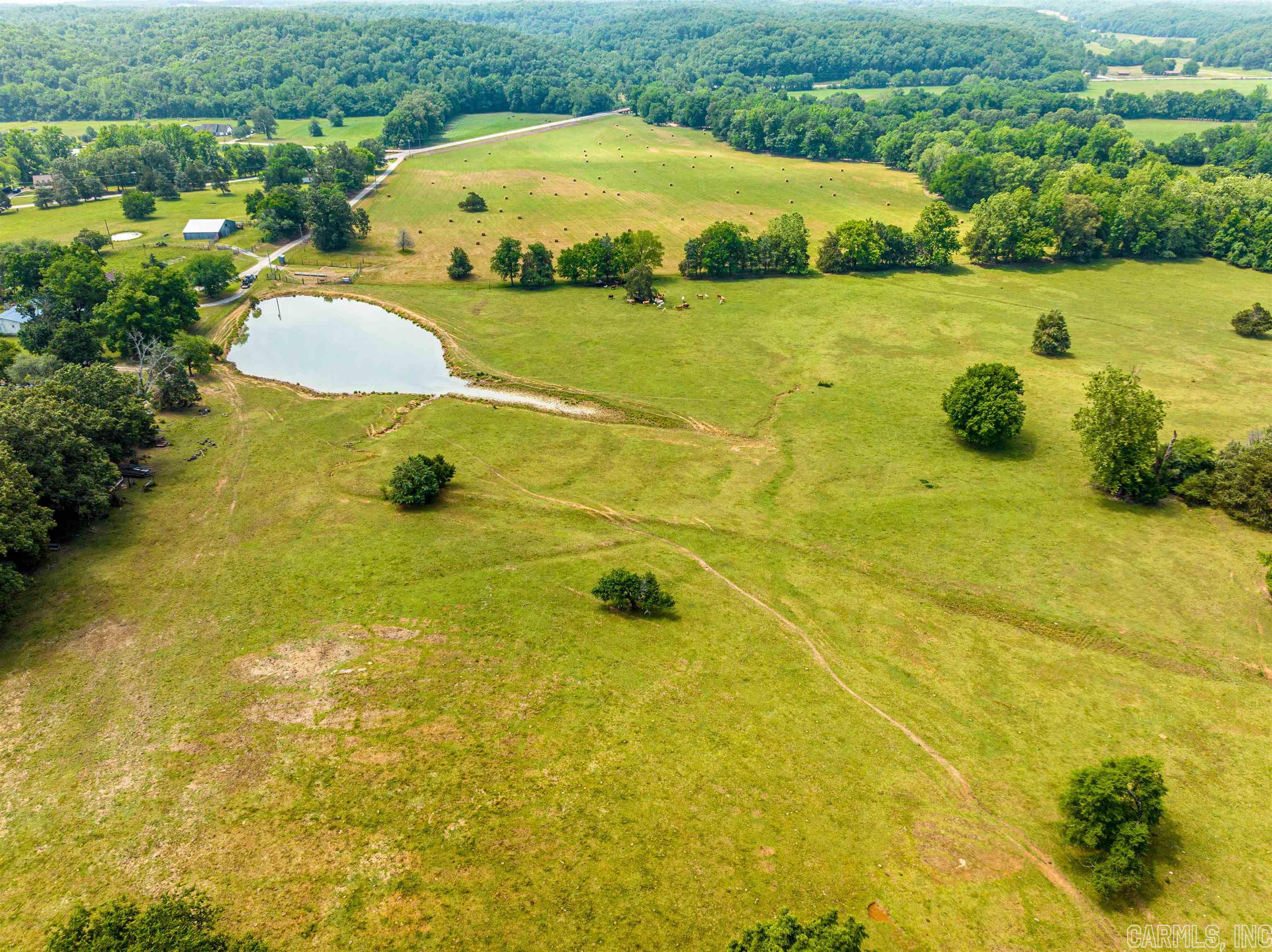 116 +/- Acre Hay and Cattle Farm! This property is mostly pasture with woods, creek, and ponds. Just off Highway 25 on the outskirts of Batesville, Arkansas, this would make a great farm for someone! With the way this farm is laid out, you have a few acres on the south side of Highway 25 with Dota Creek on it, and then you have the remaining on the north side all in one piece! This property has some Highway 25 frontage and a private drive to the gate entrance. Nice property in a great area! This will not last long!