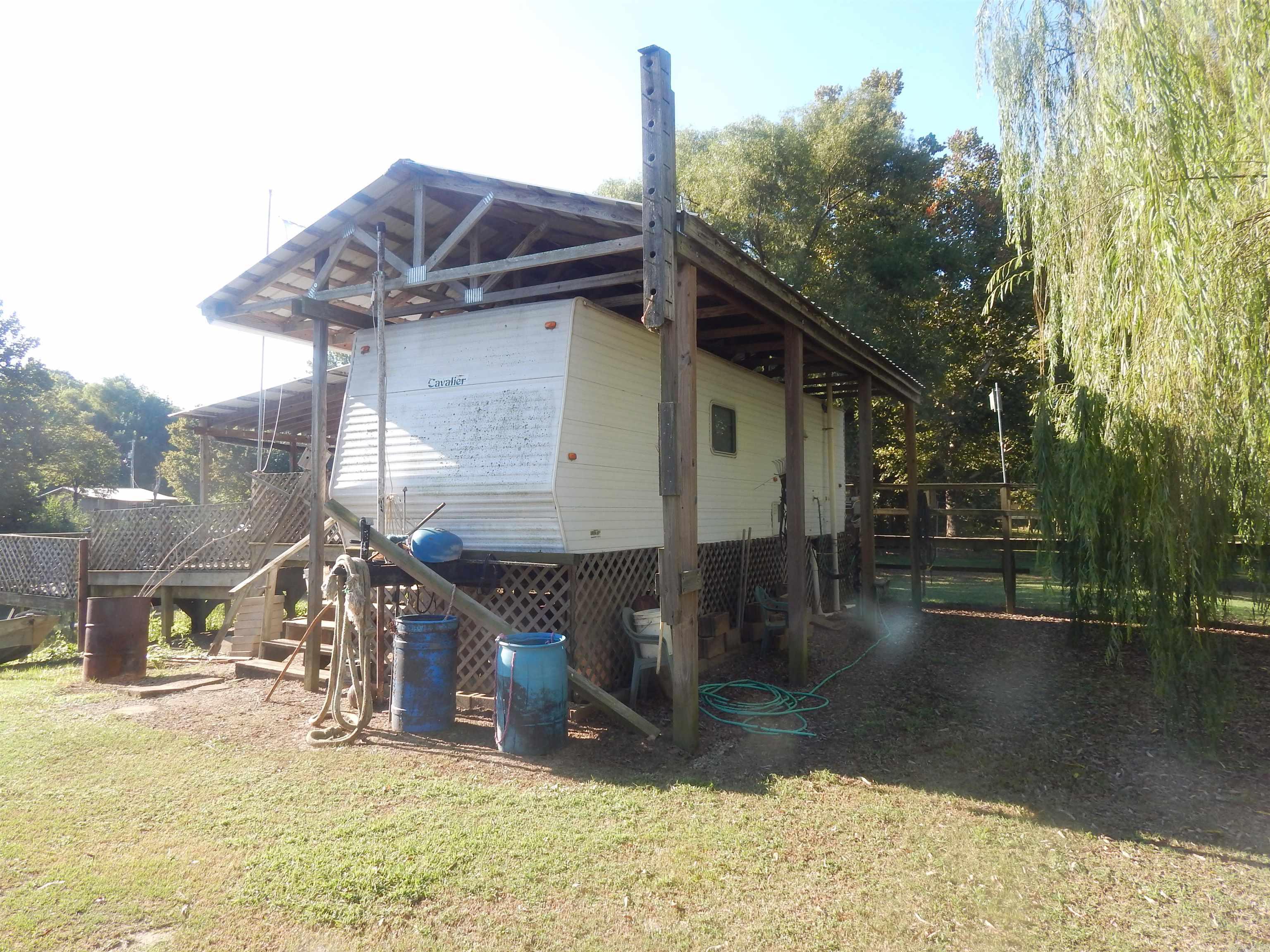 3/4 ACRE LOT LOCATED ON BIG SLOUGH DITCH WITH 320 SQ FT FEMA TRAILER, HAS WOOD DECKS AROUND BOATHOUSE. GREAT PLACE TO JUST GET AWAY FROM EVERY THING, GO FISHING AND ENJOY LIFE.