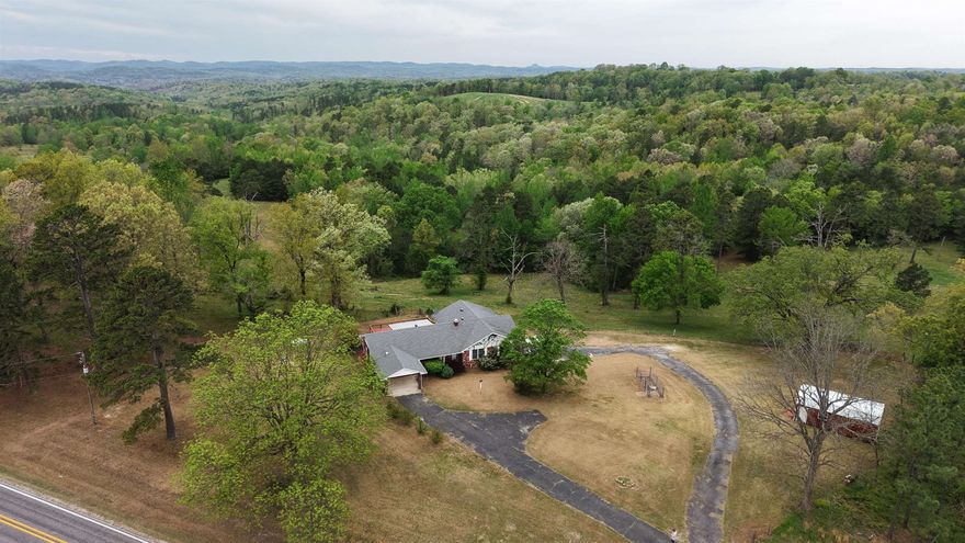Land and Home for sale in Arkansas! 47.05 Acres with Brick Home, Ponds & Mountain Views | Melbourne, AR | Izard County Land for Sale. Located in the heart of North Central Arkansas, this stunning 47.05± acre surveyed property at 4721 W AR 58 Hwy, Melbourne, AR offers the perfect blend of pastureland, privacy, and country living in the Ozark Mountains. This 2322 sq ft brick home with basement features 3 bedrooms, 3 bathrooms, and a functional layout designed for comfort and flexibility. The home includes central heat and air, plus a backup furnace, ensuring efficiency year-round. Inside, you’ll find a dedicated office space, a bright sunroom, and spacious living areas. With a covered back deck overlooking rolling pasture and breathtaking mountain views, creating the perfect setting for relaxing. The land is fully surveyed and fenced and ready for use, featuring established pasture ideal for cattle or horses, along with two ponds that add both beauty and functionality. Whether you’re looking for a working farm, horse property, hobby farm, or rural retreat, this property checks all the boxes. Conveniently located near Melbourne, Arkansas, Priced to sell at $367,000