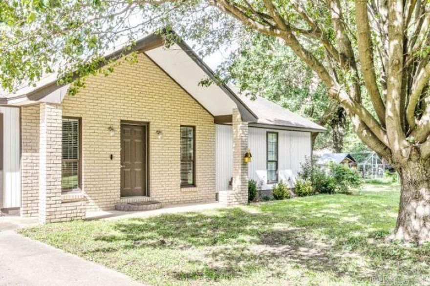 Charming 3 Bedroom, 2 Bath Home with a new roof, land .49+/- acres, located in the lovely community of Trumann. Just 20 Minutes from Jonesboro. Step outside to a sprawling backyard that spans approximately half an acre. Imagine hosting BBQs, gardening, or simply relishing in the serenity of nature being the surrounded by mature large shade trees. One of the remarkable aspects of this property is its prime location. While you'll enjoy the peaceful ambiance of a small town, you're just a short 20-minute drive away from a busy city that offers abundant job opportunities, a thriving industrial sector, a renowned college, and several top-notch hospitals. This is the epitome of having the best of both worlds - the tranquility of a close-knit community coupled with the convenience of urban amenities. Don't miss out on the chance to own this charming 3 bedroom, 2 bath home with land, strategically positioned between small-town charm and city vibrancy.