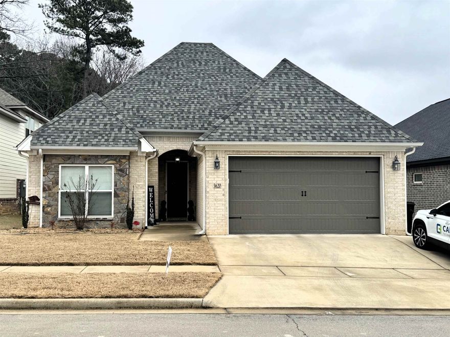 Start 2025 in this stunning custom-built 2020 home in a sought-after gated Bryant community! This spacious 3-bed, 2-bath, 1,775 sq. ft. beauty offers a private oasis with a gorgeous in-ground saltwater pool for ultimate relaxation and entertainment.  Inside, enjoy high-end LVP scraped hardwood flooring, crown molding, 2" blinds, and custom window treatments. The chef’s kitchen features upgraded granite, a large island, commercial-grade double oven gas range, and plenty of cabinetry, plus a large pantry. The open-concept living area boasts 14-foot ceilings, a rock gas log fireplace, and seamless flow into the kitchen and dining areas!   The expansive primary suite offers a luxurious bath with a soaking tub and separate water closet. The extra-large laundry room provides ample storage.  Outside, a full-house generator, 3rd parking slab, and concrete walkway lead to the pool. Additional features include a carriage-style garage door, custom lighting, and gutters for added curb appeal.  Meticulously designed with no expense spared, this move-in-ready home is waiting for you! *Schedule a showing today by seeing remarks!*