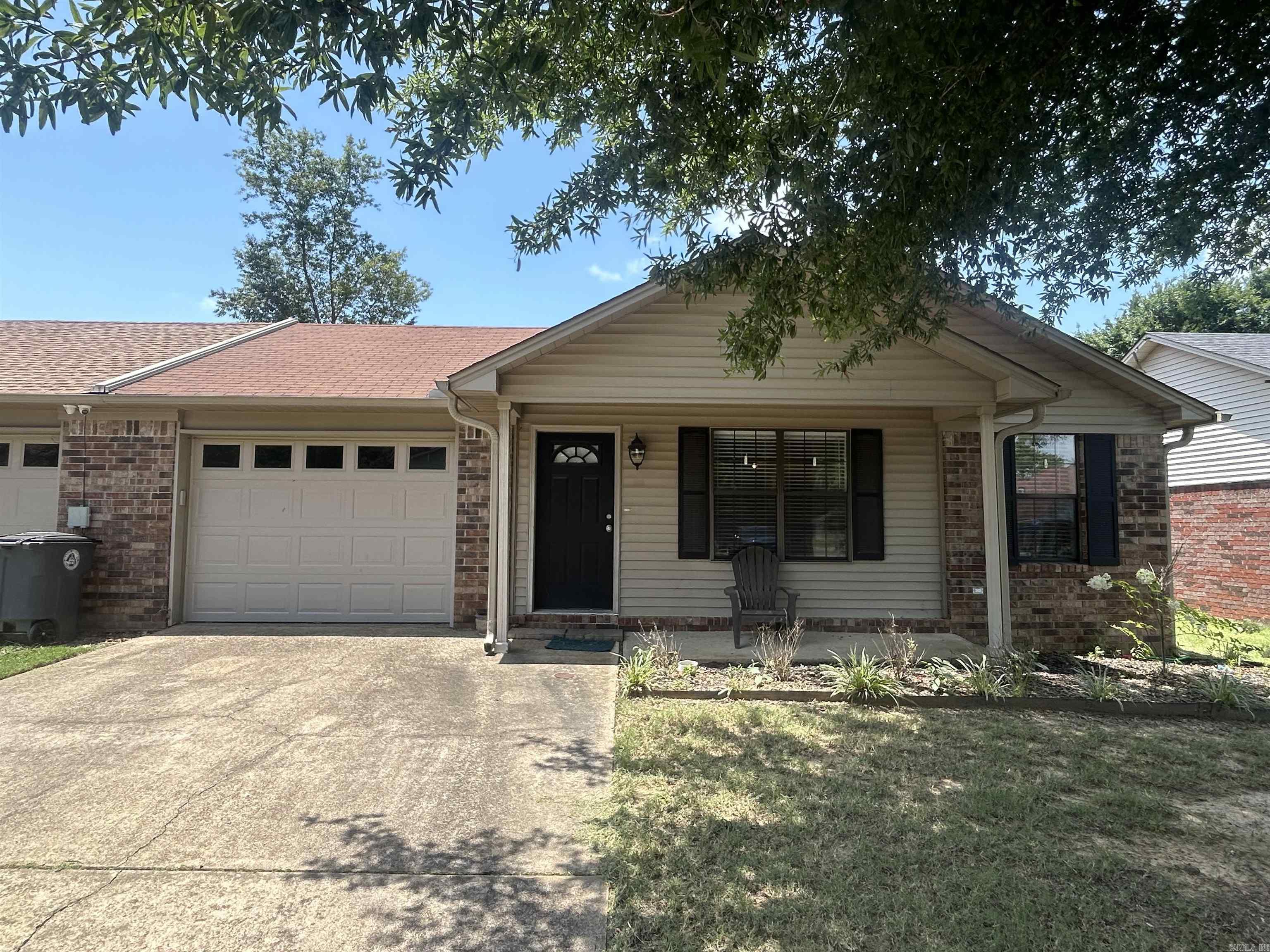 Updated 2 bedroom, 2 bath duplex with open floorplan in the living room, kitchen and dining. breakfast bar, vaulted ceiling, covered patio, privacy fenced yard and a one car garage.