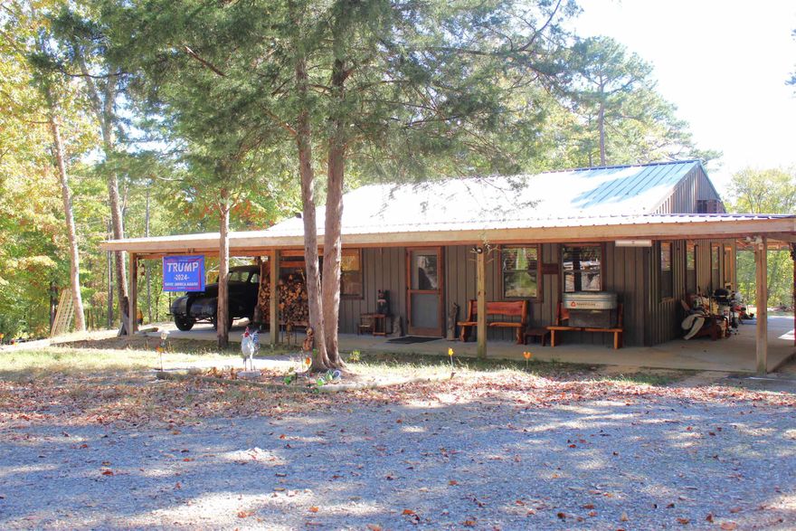 Very Nice 2 bed 1 bath cabin just 5.6 miles from Greers Ferry Lake. Tucked behind the trees and sitting on 4 acres, this would be a great primary residence or weekend getaway.  10 ft covered porch all the way around the house, property offers shop, additional out building, chicken pin, storm shelter, and small pond.