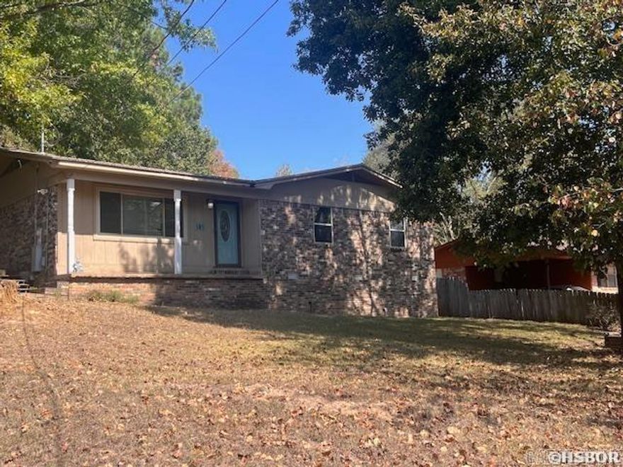 This house located in the Lakeside School District sits on a corner lot with partial wooded area in the back for privacy.  The kids will love to play in the back yard and extra wooded area!  Additionally, there is a storage building with electricity  that has multiple uses, could be extra storage, a home office, a kid's play room....so many options.  The house offers 3 bedrooms with a half bath in the primary bedroom and a full, updated bathroom in the hall.  The kitchen is open to the dining area so the family can discuss the day's activities as dinner is being prepared.  The separate living room boasts large windows for added sunlight.  There is carport plus an added parking area so there is plenty of parking room. Investors, the house has most recently been an investment property with a monthly rent of $1,500.  Property could be used for either a primary residence or investment income.  New HVAC and updated bathroom in 2020, new stainless steel kitchen appliances in 2023, new tankless water tank 2024, new windows in 2010.