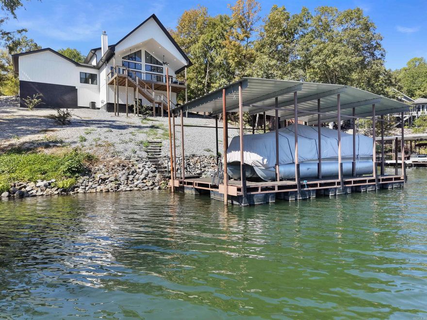 Whoa! Custom 2 Yr old Castleberry Resale with 121' of Lake Coronado WATERFRONT! Enjoy picture perfect views from every window in this smartly designed floorplan! With 2 guest bedrooms (each with their own full bath) upstairs, all of the remaining living space is on the MAIN FLOOR! The primary bedroom boasts an elegant ensuite with walk-in closet and laundry (alternate hall laundry room possible). The gourmet island kitchen features beautiful quartz counters, shaker cabinetry with slide-outs, and a smooth-top range! From the soaring cathedral ceiling to the rounded corners and wood-burning fireplace, every detail has been thoughtfully considered! The entertainment-sized deck faces east for amazing sunrises and shaded summer barbeques. Your own boat dock with lift awaits your trip out on 380 acre Lk Coronado (HSV's 2nd largest lake)! An extra pantry is designed for a potential lower level staircase access if a future basement is desired. Tough to find a newer home on the lake, but here it is! 26,000 acre Hot Springs Village offers 11 lakes & 9 golf courses + pickleball, tennis, fitness center, 2 pools, 2 marinas, a performing arts center, 20+ miles of walking trails, and much more!