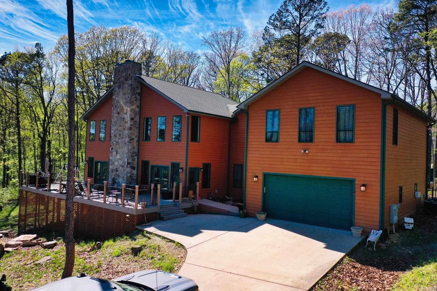 5BR Golf Course Home in Fairfield Bay – Overlooking Indian Hills #7 & #8 with Waterfall Views! Situated on two lots backing up to hole #7, this spacious 5-bedroom, 4.5-bath home offers 3,615 sq ft of well-designed living space on the scenic Indian Hills Golf Course in Fairfield Bay. The main level features an open dining and living area anchored by a stone fireplace. Step out onto the front deck, where you can overlook the tee box of hole #8 and enjoy the relaxing sound of a nearby waterfall—a truly unique setting. A separate den with patio doors leads to another deck overlooking hole #7. The Master suite is also on the main level with multiple vantage points to take in the beauty of the course. Upstairs, you’ll find 4 bedrooms and 3 full baths, two being en suite bedrooms, each with private deck access overlooking the golf course. One bedroom features an adjoining playroom or flex space, perfect for kids, guests, or a hobby area. Additional features include a 24x36 garage, a safe room located beneath the side deck, and low-maintenance construction with cement Hardie board siding and composite decking—designed for durability and easy upkeep. Enjoy access to Fairfield Bay amenities