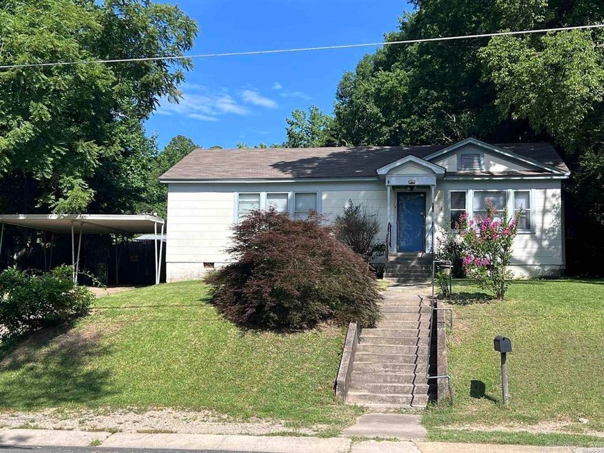 Welcome to this adorable 3-bedroom, 2-bathroom bungalow nestled in the heart of Hot Springs! Located just minutes from the vibrant downtown scene, this home offers the perfect blend of character, space, and convenience. Whether you're looking for a full-time residence, weekend retreat, or investment opportunity, this property is full of potential!  Step inside to discover nearly 1,700 square feet of living space featuring spacious rooms, perfect for entertaining or simply spreading out and relaxing. The layout flows easily, with natural light brightening each corner of the home. The large back deck offers a nice spot for morning coffee, weekend barbecues, or enjoying a good book in the fresh air.  Outside, you’ll appreciate the storage building, providing extra room for tools, seasonal items, or a potential workshop. The seller has never occupied the home and is offering it as-is, giving buyers the chance to put their own personal touch on this charming space.  Don’t miss out on this ideally located gem—close to shopping, dining, entertainment, and all that historic Hot Springs has to offer!