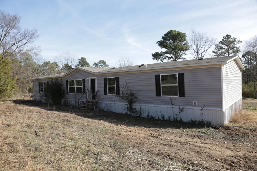 Welcome to your perfect countryside retreat! Enjoy serene living in this spacious 5-bedroom, 3-bath mobile home nestled on 5 acres, this property offers ample space and tranquility. Perfect for family living and outdoor enjoyment. This mobile home is ready for you to move in and make it your own!  Please ask your agent about Seller Financing that may be available with a down payment. Property could be eligible with $0 down financing thru Rural Development, all with approved credit.