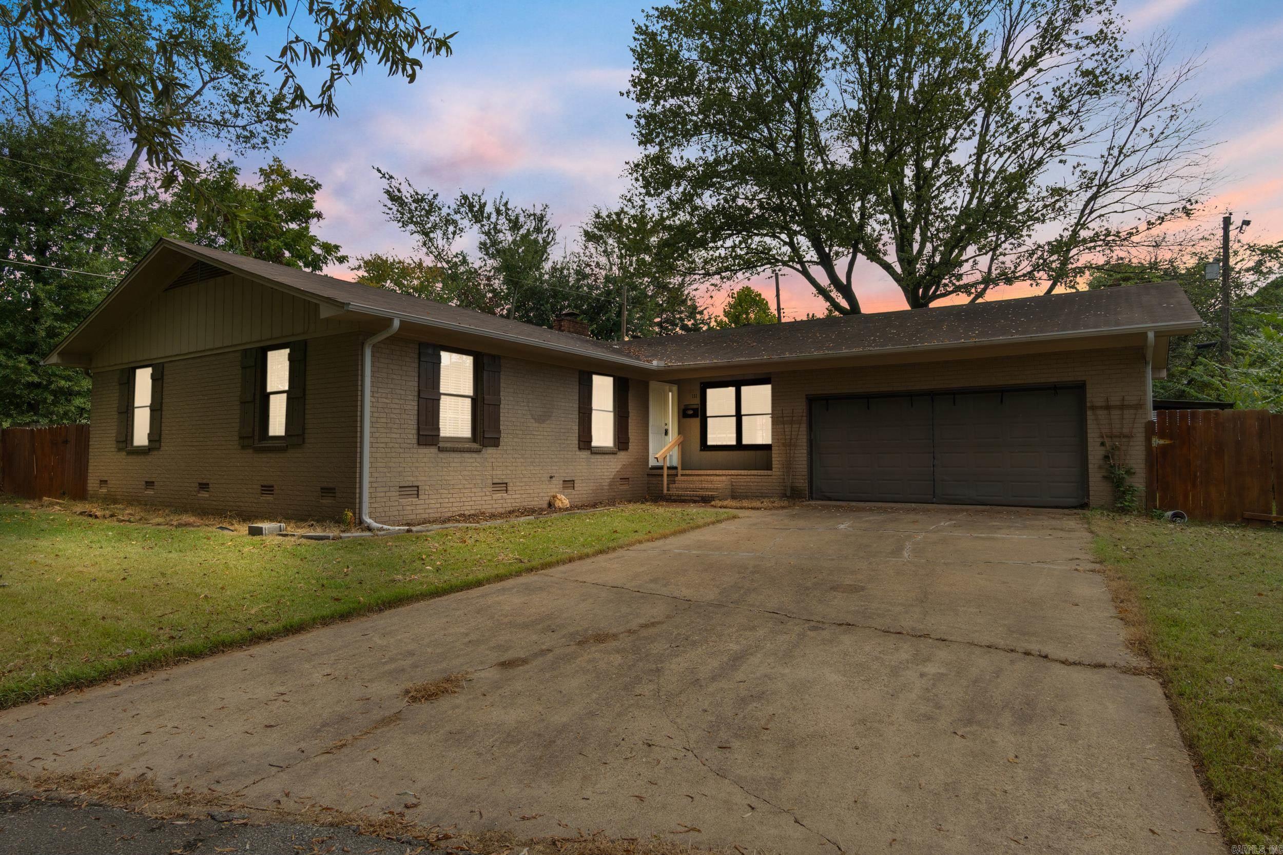 Welcome Home! This charming 3-bedroom, 2-bath home offers approximately 1,700 sq ft of living space and is tucked away at the end of a quiet cul-de-sac near Searcy High School. Inside, you'll find a beautifully updated kitchen featuring stainless steel appliances, an eat-in bar, built-in desk, and backside bar cabinets—all part of a spacious open-concept layout. Original hardwood and tile flooring flow throughout the home, adding character and durability. Recent upgrades include: New roof (2019), water heater (2021), front door (2022), rain gutters with leaf guards (2023), french drain system (2023), HVAC fan replacement and cleaning (2024), plumbing service (2024), and a laundry room renovation (2025) Outside, enjoy generous front and back yards, a 2-car garage, large barn-style shed, storm shelter, and an RV gate—perfect for extra storage or recreational vehicles. Don't wait, schedule your showing today! Agents, see remarks regarding recent appraisal value!