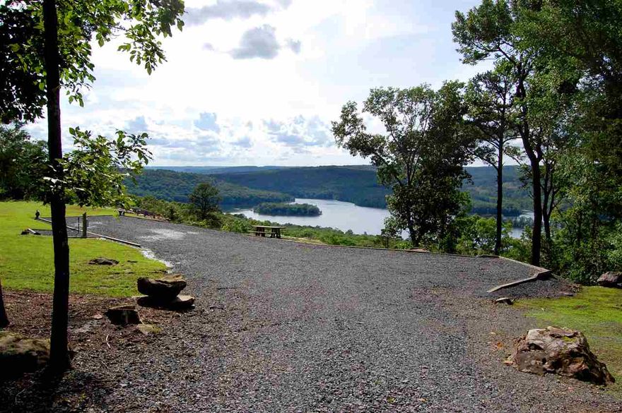 Amazing panoramic lake view from this private manicured 3 acre lot already set up to start building your lake home on top of the mountain. All utilities including septic system for 4 bedroom home, water, and electric already in place. Have your boat in the water in just minutes at the ramp just down the hill at Frontier Canyon. Must see this to really experience the beauty of the view. Adjacent 3 acre lot also available for additional $84,500.