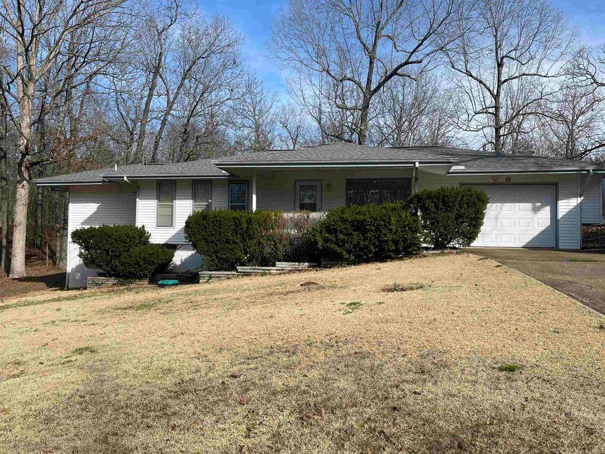 Move-in ready, well-maintained home on over a half acre of ground! The home features 2 bedrooms, 2 bathrooms, walk-in closet, vaulted ceilings in the living room, open kitchen/dining area, screened-in porch, water softener, two water heaters (one electric, one propane), a back-up propane wall heater, an attached garage, plus a small room under the home with electricity to go if you get scared of bad weather! The 24X24 shop has electricity and concrete floor and the storage building has electricty as well.  The large, fenced back yard is a great place to enjoy watching wildlife, and would be perfect for kids or pets!