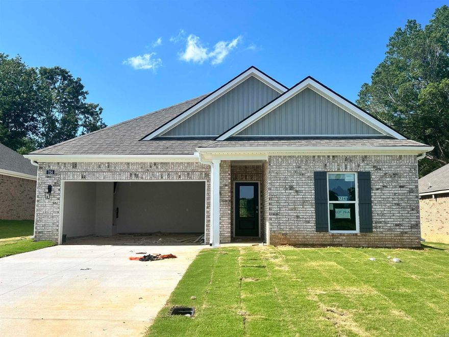 Under construction. The appealing one-story home includes many contemporary features.  An open-concept design including 9' ceilings enhance the wonderful feel of this home. The kitchen includes a large counter perfect for bar-style eating or entertaining, a spacious pantry and plenty of cabinets and counter space. The large living room overlooks the patio, which is a great area for relaxing and dining al fresco. Bedroom One, located at the back of the home for privacy, can comfortably fit a nice size bed, and includes an en suite bathroom with a vanity and big walk-in closet. Two other bedrooms share a second bathroom. The two-car garage connects to a small hallway where the laundry room is located. Pictures, photographs, colors, features, and sizes are for illustration purposes only and will vary from the homes as built. Additional Features include: granite countertops, kitchen appliances provided are refrigerator, stove, microwave, dishwasher, electric fireplace, brick, gutters, blinds, double sinks in master, walk in shower, 2 car garage, 10 year warranty.