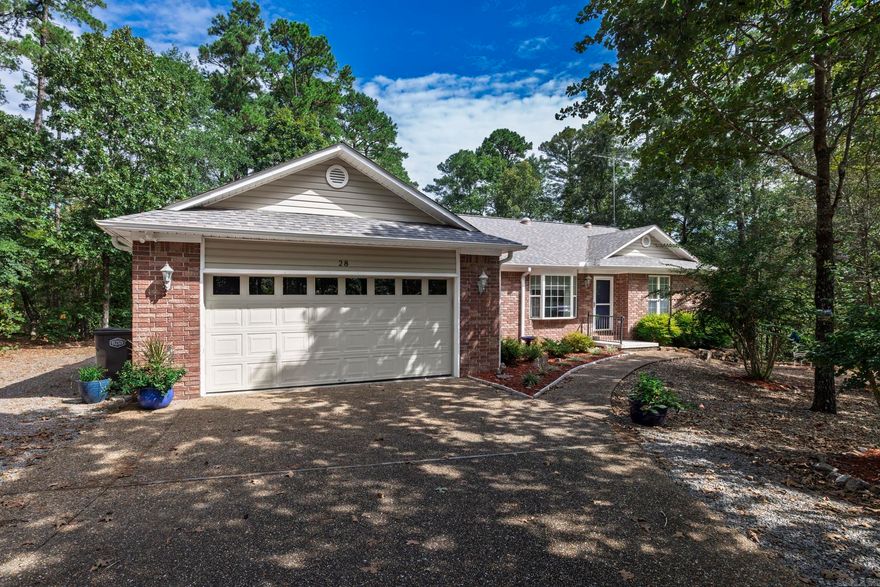 This popular Craig Keaton floor plan is move in ready. Brick front and vinyl sides and rear. Partially covered deck. Oversized two car garage with window unit AC. Aggregate finish driveway and sidewalk. Low maintenance landscaping. Level driveway and yard. Concrete slab in crawl space for small item storage. New roof and HVAC in 2022. Living /Dining combo, vaulted ceiling, kitchen has double cabinet pantry, laundry room with storage closet, large primary bedroom with walk in closet, primary bath with double vanities, jetted tub and walk in shower. Guest bedrooms apart from primary. Guest bath has walk in shower. Three sun tubes for great natural daytime light. Carpet in bedrooms and LVP in living areas. Gas log fireplace. BONUS -- Common property on one side and to the rear and vacant lot on the other side. Well established golf course neighborhood home with privacy.   l