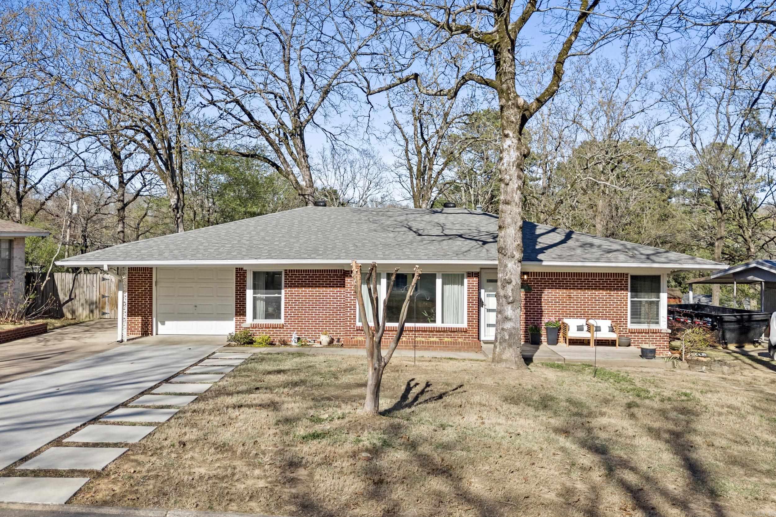 Welcome to this beautifully updated 3-bedroom, 2-bathroom home, just one block from the iconic Old Mill and scenic Lakewood Lakes #2 and #3 — perfect for fishing, boating, and exploring. Combining historic charm with modern updates, this home features original hardwood flooring and a sleek, contemporary interior. The primary suite offers his and hers walk-in closets. The updated kitchen showcases modern finishes and new appliances. Rest easy knowing major updates are already complete, including a new roof, HVAC, and hot water heater. Step outside to enjoy the expansive back deck. The newly extended driveway provides plenty of parking space, and the Tesla charger offers convenient and efficient charging for your electric vehicle. Nestled in a prime location, this home offers the perfect blend of outdoor amenities and modern comfort. Don’t miss your chance — schedule your showing today!