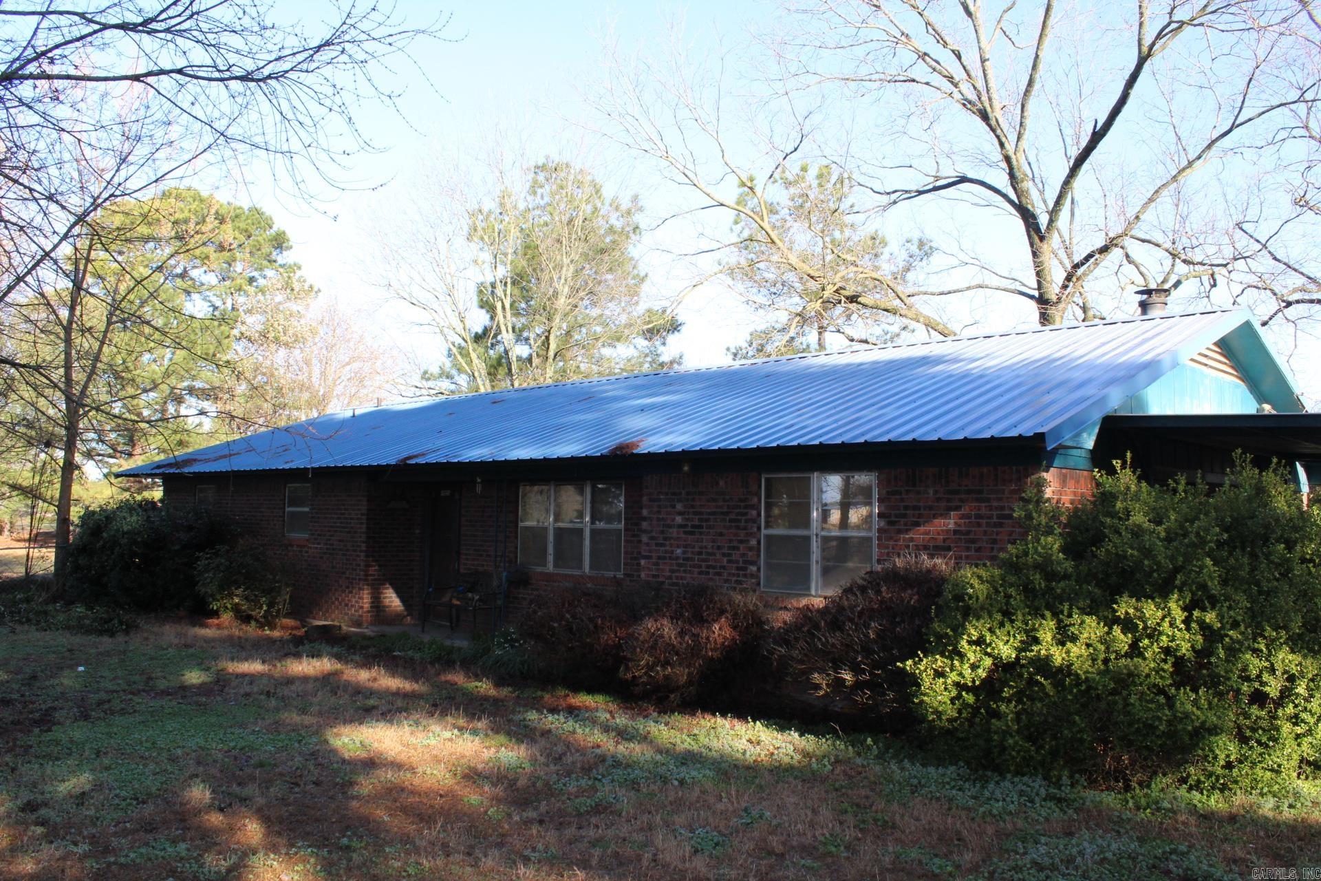BRICK HOME WITH APPROX. 73.3 WOODED ACRES . 3 Bed, 2 Bath brick home with approx. 1712 Sq. Ft. of living space. Central A/C & Heat. Metal Roof.