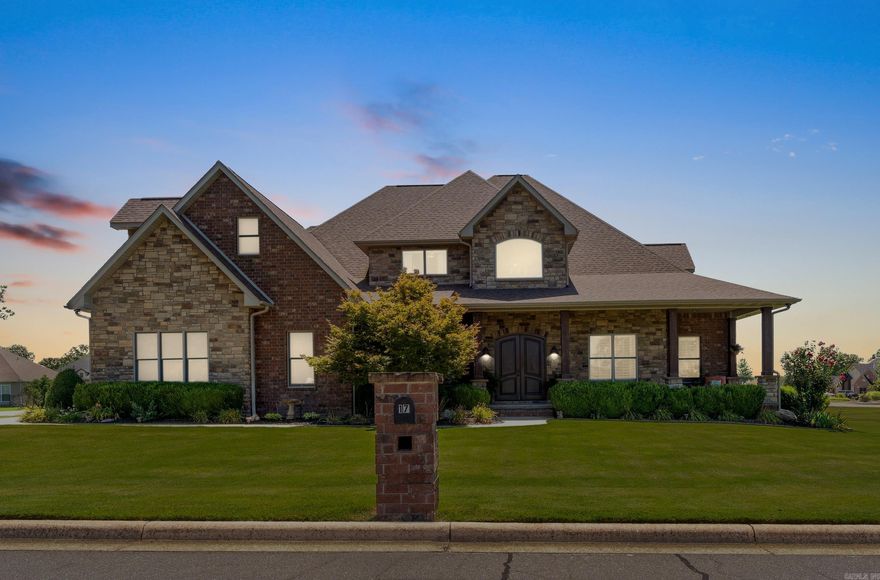 Discover timeless elegance in this custom-built masterpiece, perfectly positioned on an oversized cul-de-sac lot within the coveted Big Creek Country Club community—home to Mountain Home’s top-rated, 5-star golf course. From the moment you enter, you're greeted by a stunning living room with soaring vaulted ceilings, exposed wooden beams, floor-to-ceiling glass windows, and custom built-in shelving—all bathed in natural light for a dramatic yet inviting atmosphere. The gourmet kitchen is a chef’s dream, offering extensive cabinetry, generous counter space, and refined finishes. Perfect for entertaining, this home features a sleek wet bar, elegant Italian tile, and a seamless flow to the outdoor living area with a built-in grill and a second fireplace. The spa-like primary bath boasts dual vanities, a soaking tub, and a walk-in shower. A ventilated storm shelter offers peace of mind, while a new roof (2023) adds lasting value. Sophisticated, serene, and built with intention.