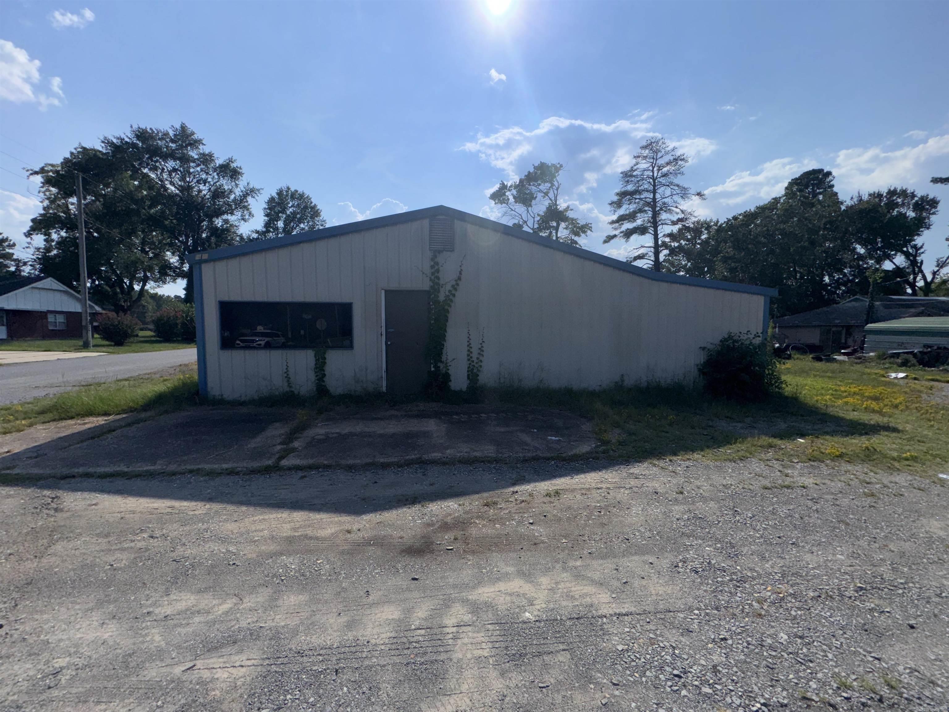 This commercial property features a spacious building encompassing 4,960 square feet, ideal for a variety of business uses. The structure boasts a flexible layout, allowing for customizable interior configurations to suit retail, office, or light industrial needs. The property includes convenient parking facilities, easy access points for customers and staff, and is situated in a prime location with high visibility and accessibility to major roads.