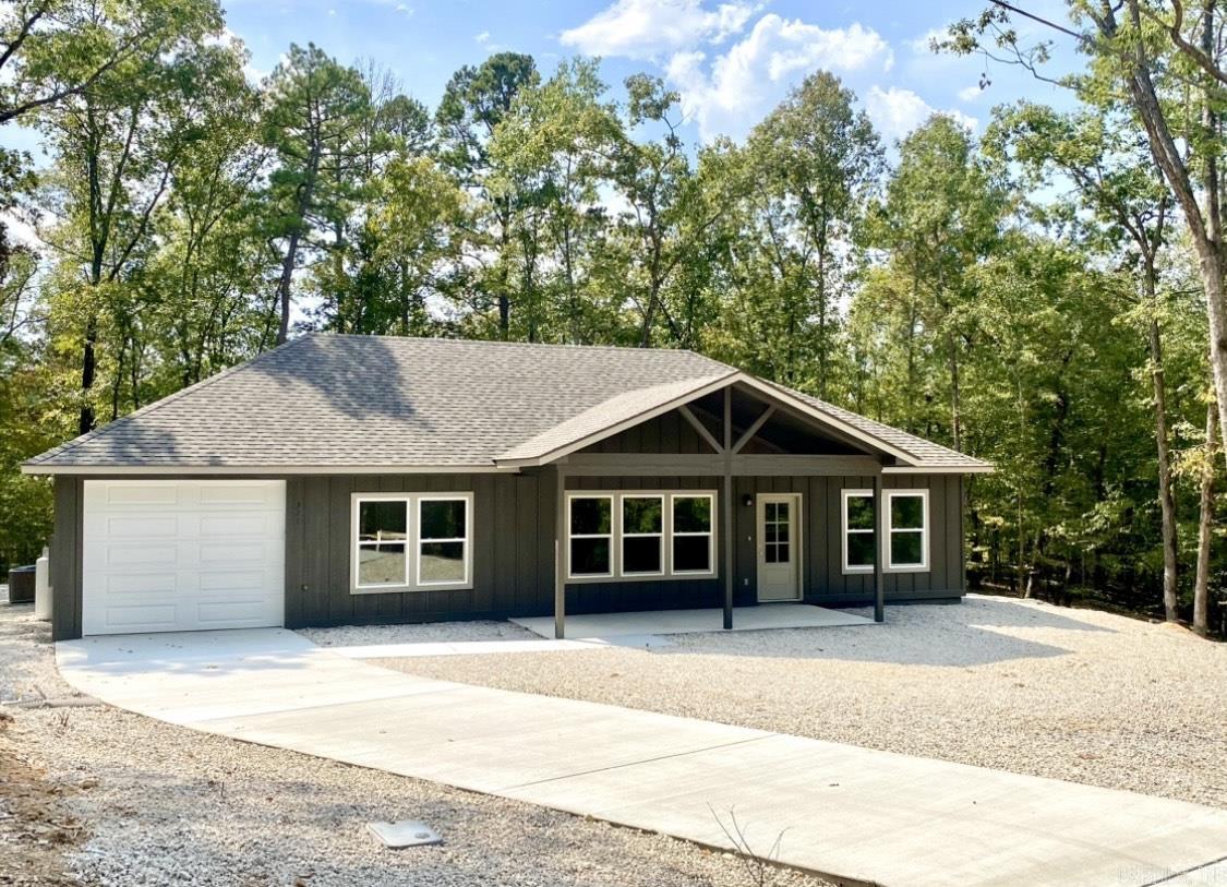 READY BY MID-JULY...You CAN HAVE IT ALL in this beautiful NEW One-Story home UNDER CONSTRUCTION in the picturesque Lake and Golf community of Diamondhead in Hot Springs! You'll enjoy 2 spacious bedrooms with adjoining luxury baths, plus a SPACIOUS OPEN PLAN for the Living/Dining/and Kitchen... with vaulted ceilings and easy care wood-look tile planks, great for entertaining and pet lovers. The kitchen has upgraded honed Granite countertops, Stainless Appliances. white Shaker cabinets, and a HUGE ISLAND! The FIREPLACE with gas logs offers a cozy ambiance in the living area. You'll feel spoiled in the Primary bath with a Granite top vanity with double sinks and seperate mirrors, a large Walk-In CUSTOM SHOWER with a relaxing rain showerhead and bench, plus a massive Walk-In Closett! Just off the kitchen is a hall leading to the garage where you'll find a storage closet, your LAUNDRY AREA, and a Walk-In PANTRY to hold ALL your dry goods, extra appliances, and more! You'll spend long hours outside enjoying both the Front and Back COVERED PORCHES in a Private Wooded setting, and the one car GARAGE