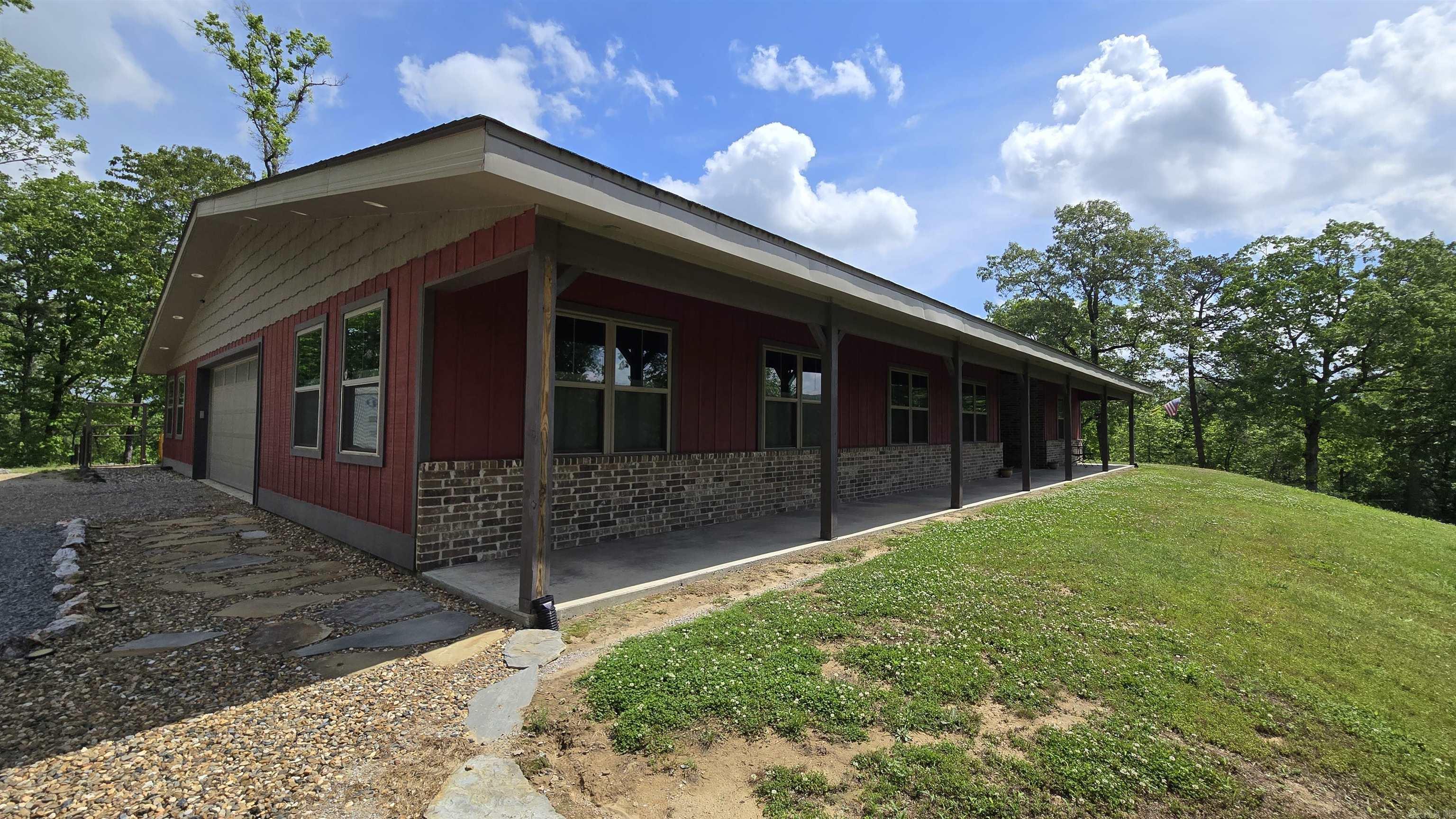 This home 2260 sq ft heated and cooled with total of 5500 sq ft under roof. It is 17ft ceilings, 3 bedroom 2 bath 2 car garage with his n her workshops. Beautifully designed kitchen with custom built cabinets and granite counter tops with soft close doors, pullouts,2 lazy susan's , 2 pullout spice racks, Farm sink, Gas stove top with electric oven. Large walk in pantry Brick gas fireplace in Living room dining room open area. Relaxing outdoor screened in back patio with built in kitchen for outside enjoyment. Also a Large 25x 50 17 ft tall Rv storage /workshop with full Rv hookups Home is handicap accessible