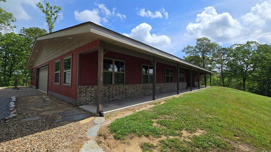 This home 2260 sq ft heated and cooled with total of 5500 sq ft under roof. It is 17ft ceilings, 3 bedroom 2 bath 2 car garage with his n her workshops. Beautifully designed kitchen with custom built cabinets and granite counter tops with soft close doors, pullouts,2 lazy susan's , 2 pullout spice racks, Farm sink, Gas stove top with electric oven. Large walk in pantry Brick  gas fireplace in Living room dining room open area. Relaxing outdoor screened in back patio with built in kitchen for outside enjoyment.  Also a Large 25x 50  17 ft tall  Rv storage /workshop with full Rv hookups Home is handicap accessible