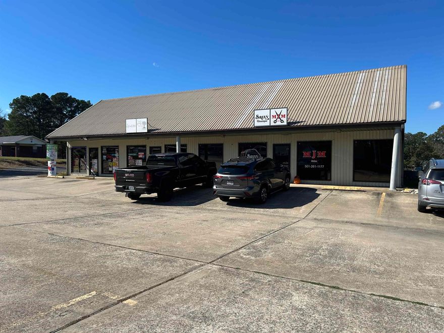 Here's the steal ** Commercial building on 1 full acre ** parking for 25+ cars ** perfect for any type of business ** currently occupied by a beauty shop, dress shop and tobacco store ** Each unit has a half bath ** ch/ca ** all maintenance free building ** Perfect opportunity in a growing community **
