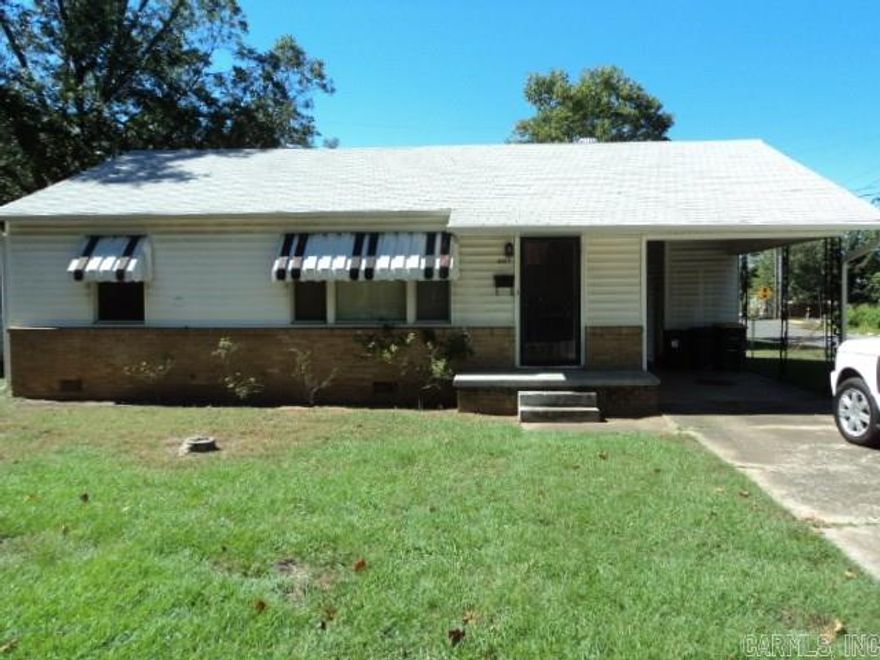 Great location on corner lot with fenced backyard, newer roof. Brick vinyl siding. Carport with extra parking pads. Large living room, entire home has original hardwood floors. Great starter home or excellent investment property.