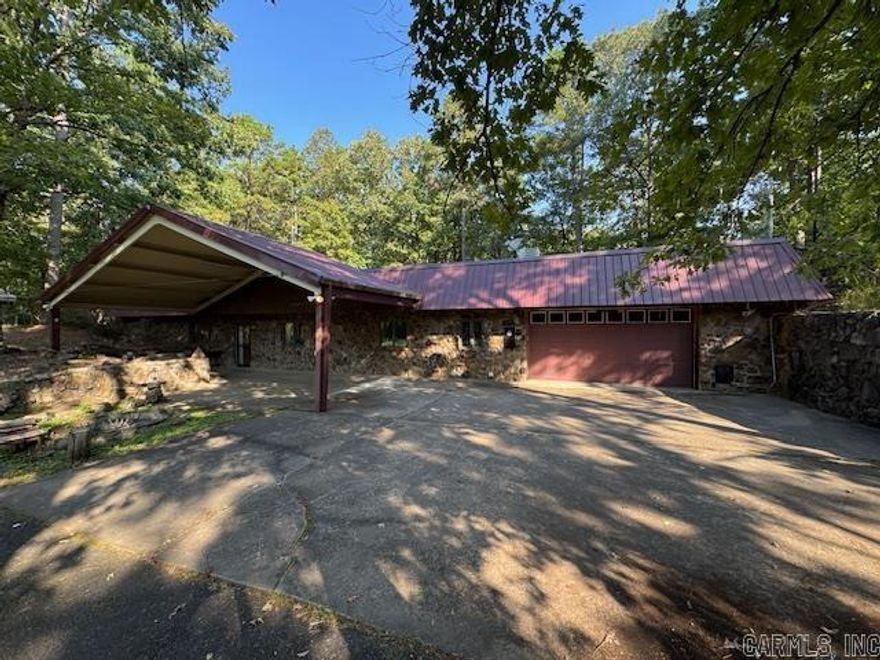 This home sits on 80+/- acres in the Harmony community, just West of Searcy. So much to offer with this unique property! Underground home with 1,904 square feet, 2 bedrooms and 2 bathrooms. Heated and cooled 2-car garage. Large Pantry Area. Open living, dining & kitchen area. 2 ponds on the property, lots of wildlife, and numerous outbuildings. The 2 large shops have electricity & overhead doors on both ends, in addition to walk-through doors. One shop has an office. There are also several smaller outbuildings, including one building with a game-cleaning setup for the hunter or outdoorsman, that has a drain in the floor and water.