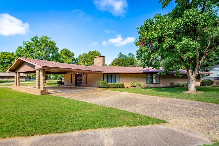 Step Back in time with this pristine Mid-Century Ranch style home.  This 3 Bedroom, 3 1/2 bath home is perfect for entertaining with its open floor plan and beautiful fully fenced backyard.  In addition to the home's original terrazzo tile floors and double fireplace it offers lots of storage space a two-car garage and covered carport. Schedule your showing today!