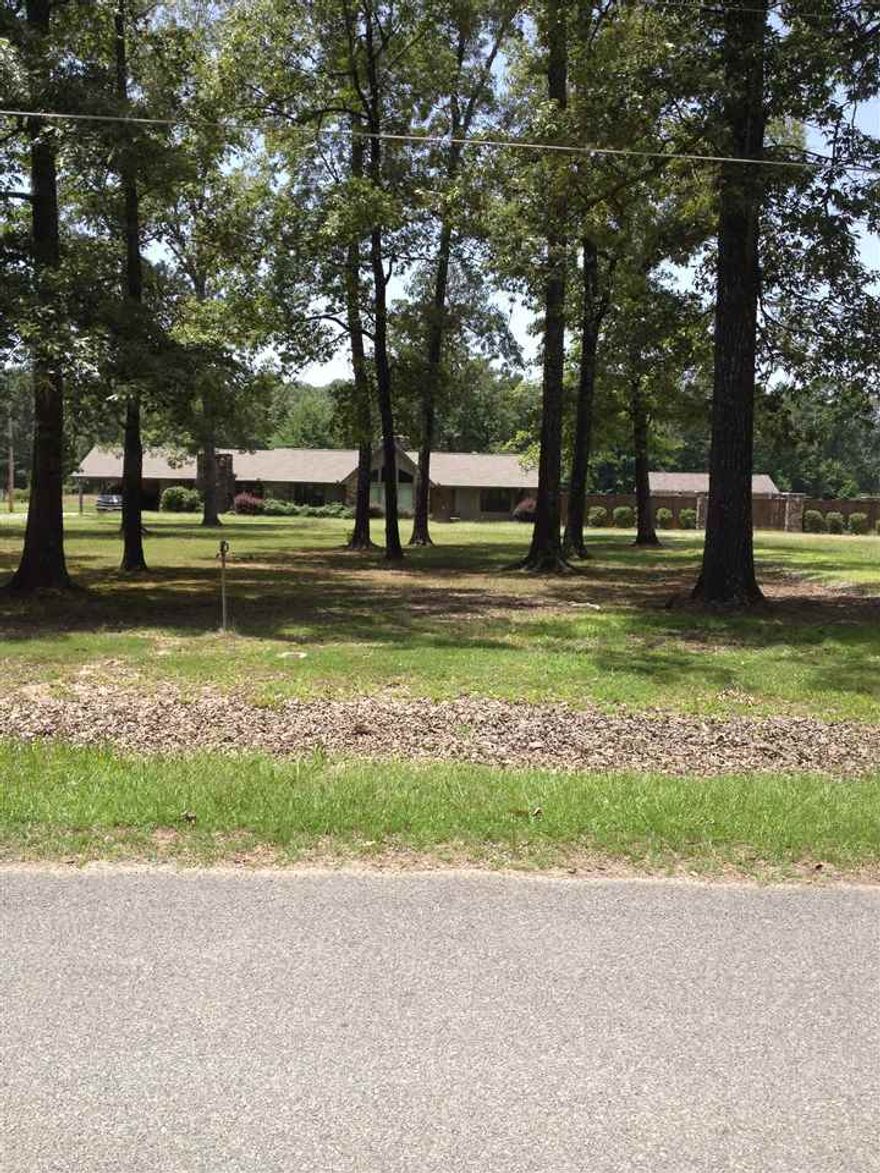 Country living,but city close. Five minutes from Wal-Mart.  Spacious home on 9.5 acres with a beautiful pool and pool house. This has got to be the largest master bedroom you will ever see.