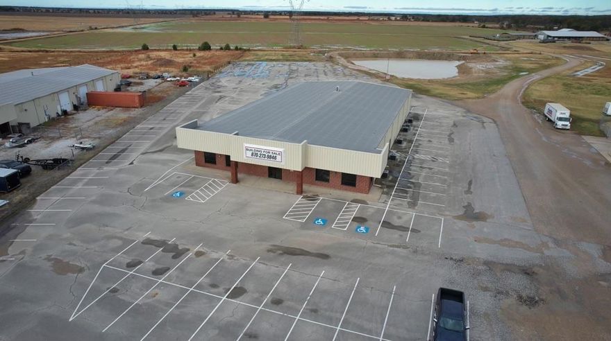 Opportunity awaits on this huge commercial building just outside city limits. Over 12,000 square feet of office space is ready for its next owner! Building also includes 180 parking spots and sits on 3+ acres.