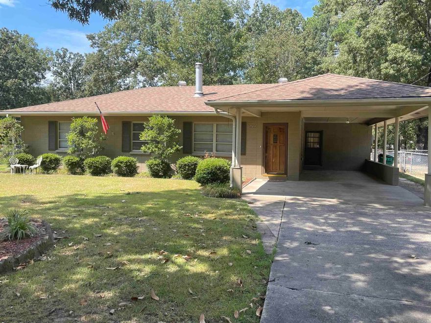 A one owner home that has been very well maintained.  Neutral color throughout, carpet, luxury vinyl, window coverings remain, all appliances remain.  Nice wooden deck out back, fenced garden spot, outside storage building 20X25 with extended roof on both sides for additional storage for lawn mower or garden equipment.  Two drives, one that leads to the double gate to the back yard, the other a concrete driveway leading to the single carport. This property is move in ready and would make a great starter home for a couple or small family.