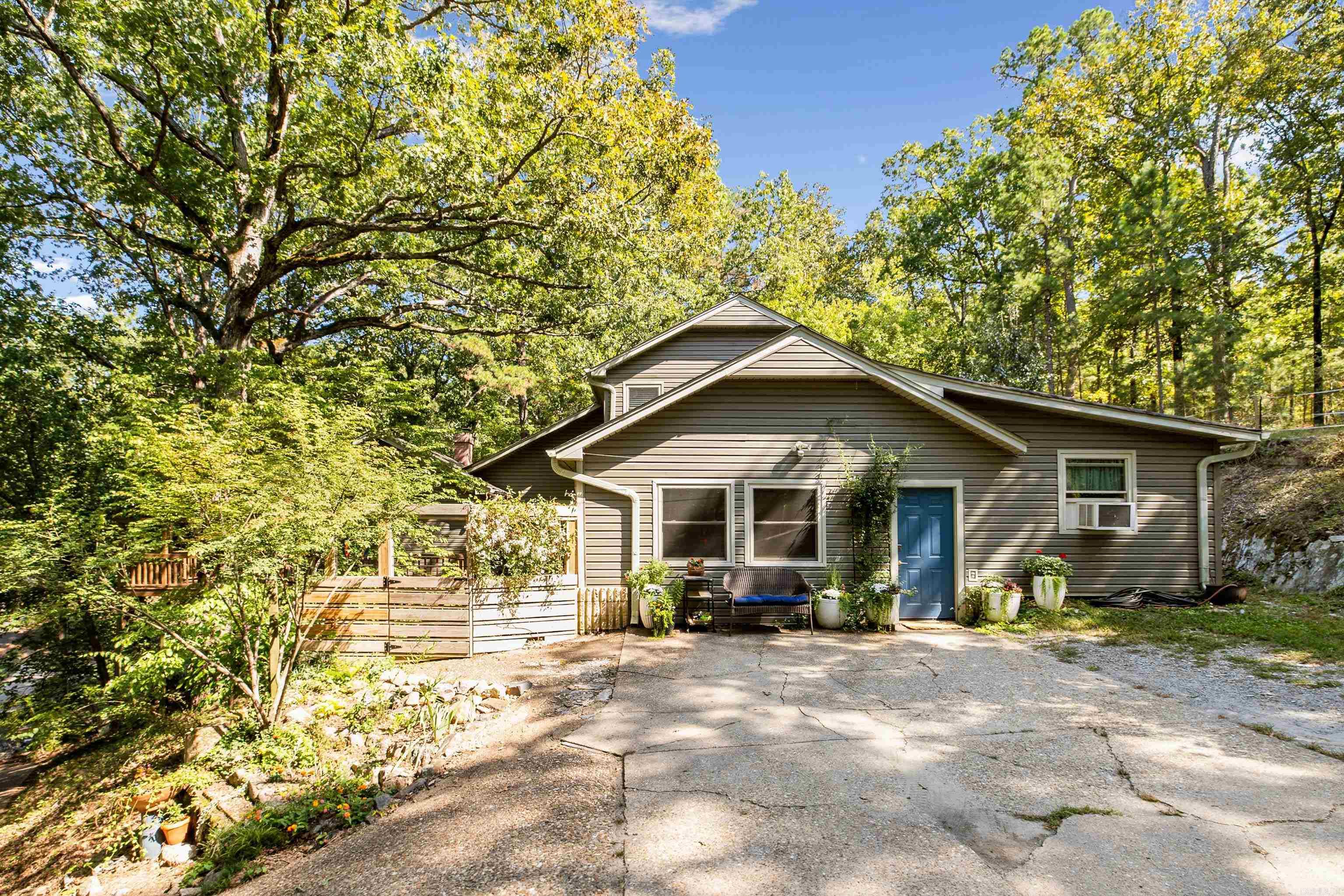 Welcome to 5 Secluded Point, a rare retreat in Little Rock’s only private swimmable lake community, offering 4 bedrooms, 3.5 baths, and over 3,100 square feet of refined living space. Tucked on a quiet cul-de-sac, this home blends comfort, nature, and sophistication with multiple living areas, soaring ceilings, and abundant natural light. The spacious layout includes a private main-level mother-in-law suite, primary bedroom on the main level is complemented by additional bedrooms with a Jack-and-Jill bath upstairs in the versatile loft. Recent upgrades—including windows, siding, gutters, and water heater—provide peace of mind, and outdoor living is just as inviting with a deck overlooking the wooded lot and two storage buildings for convenience. Beyond the home, residents enjoy exclusive access to the lake with a boat ramp, fishing, and a beach, with a playground, picnic area, and fire pit. Combining a tranquil setting with close proximity to west Little Rock shopping, dining, and top schools, this property offers an exceptional opportunity to experience lake-community living with the conveniences of the city.