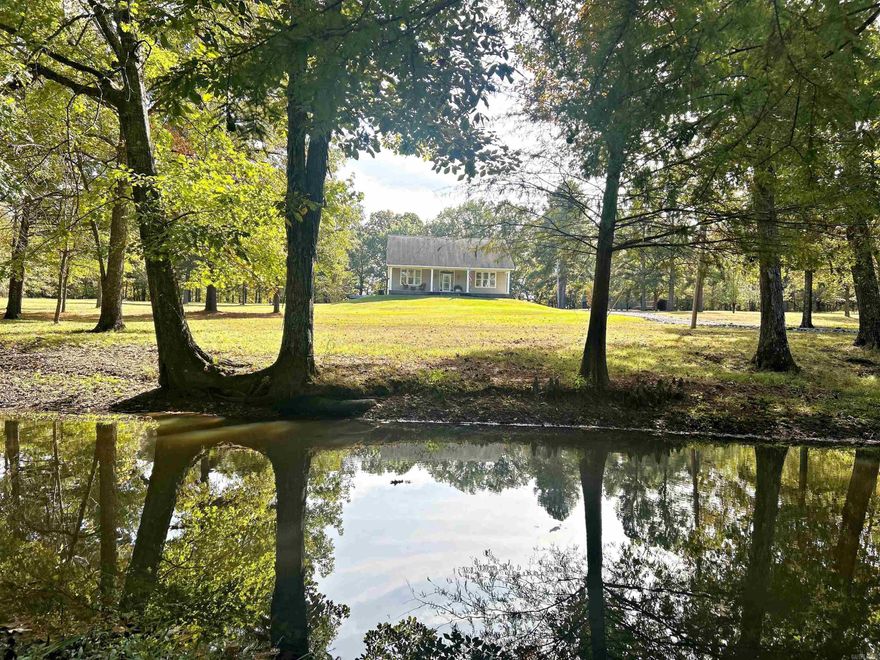 FIRST TIME ON THE MARKET!!! BEAUTIFUL, CUSTOM BUILT, ONE OWNER HOME nestled on 10.08 acres near the desirable Moon Valley Subdivision. This 3 BR/2.5 BA maintenance free vinyl siding home boast comfort, functionality, and style.  Features include 9ft ceilings, granite, crown molding, and hardwood floors plus a gorgeous stained glass window in the great room/foyer. Kitchen offers tons of cabinets & counter space, with 2 pantries and a drop down desk for special projects or hobbies. Spacious primary suite is on main level with luxurious laminate flooring. Marble tiled shower, vanity with double sinks and 2 walk-in closets. Upstairs is complete with (2) 16x16 Bedrooms, Bath and BIG BONUS CLOSET with storage galore. The exterior is just as fabulous with a front porch that lets your relax after a long day offering picturesque views of the manicured lawn looking down to pond/creek. 1 car garage/shop is sure to please with a kitchen, full bath, work benches, and extra living space. PLUS a 32x34 pole barn for your tractors, camper, boats or other toys. Come see for yourself what makes this place a TRUE GEM and A RARE FIND! New HVAC 2022, New Hot Water 2024, New Roof 2018. MOVE IN READY!